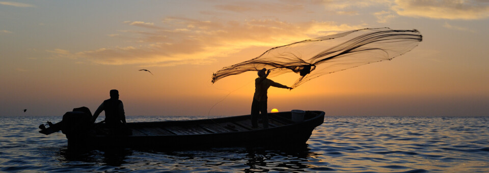 Fischer im Oman bei Sonnenaufgang